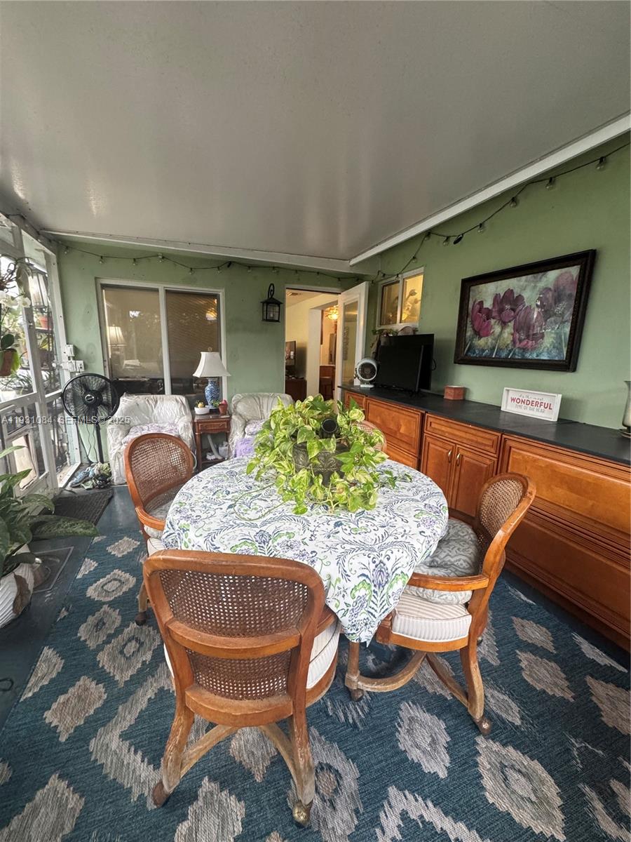 918 Southeast 16th Street, Unit 918 Deerfield Beach, FL 33441 - Photo 14 of 20 a outdoor dining space with furniture and outdoor space