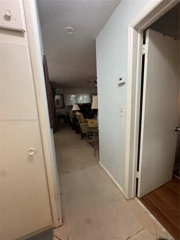 a view of a livingroom with furniture and front door