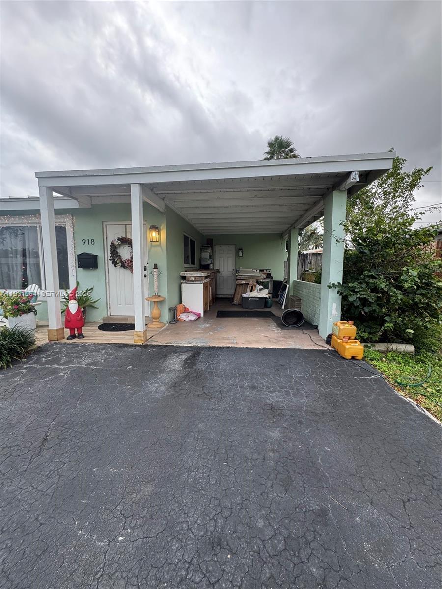 918 Southeast 16th Street, Unit 918 Deerfield Beach, FL 33441 - Photo 20 of 20 a view of the porch of a house