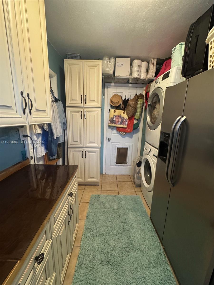 918 Southeast 16th Street, Unit 918 Deerfield Beach, FL 33441 - Photo 6 of 20 a utility room with dryer and washer