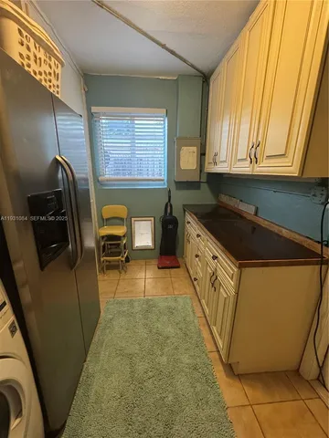 a bathroom with a tub sink and a mirror