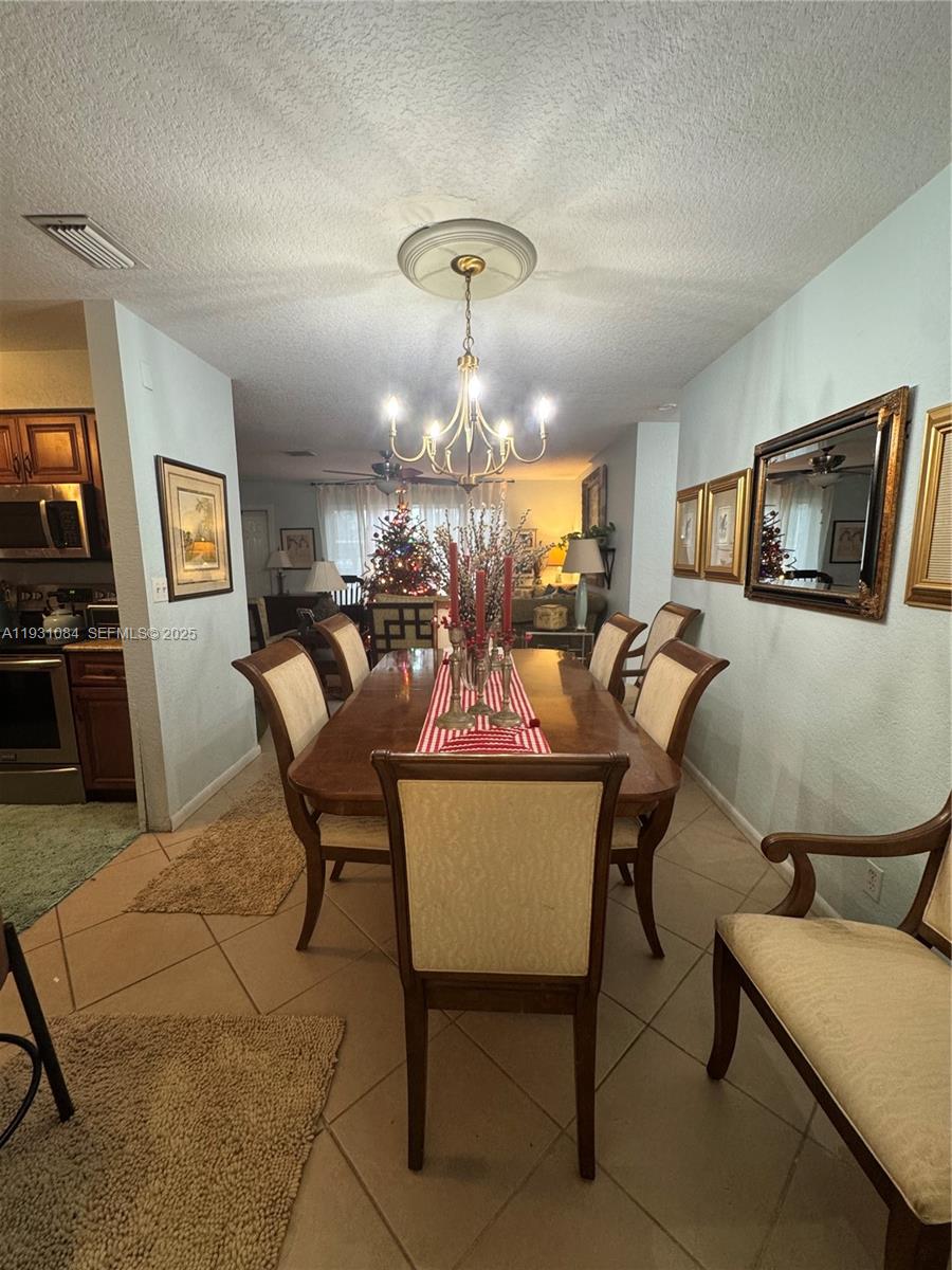 918 Southeast 16th Street, Unit 918 Deerfield Beach, FL 33441 - Photo 10 of 20 a view of a dining room with furniture