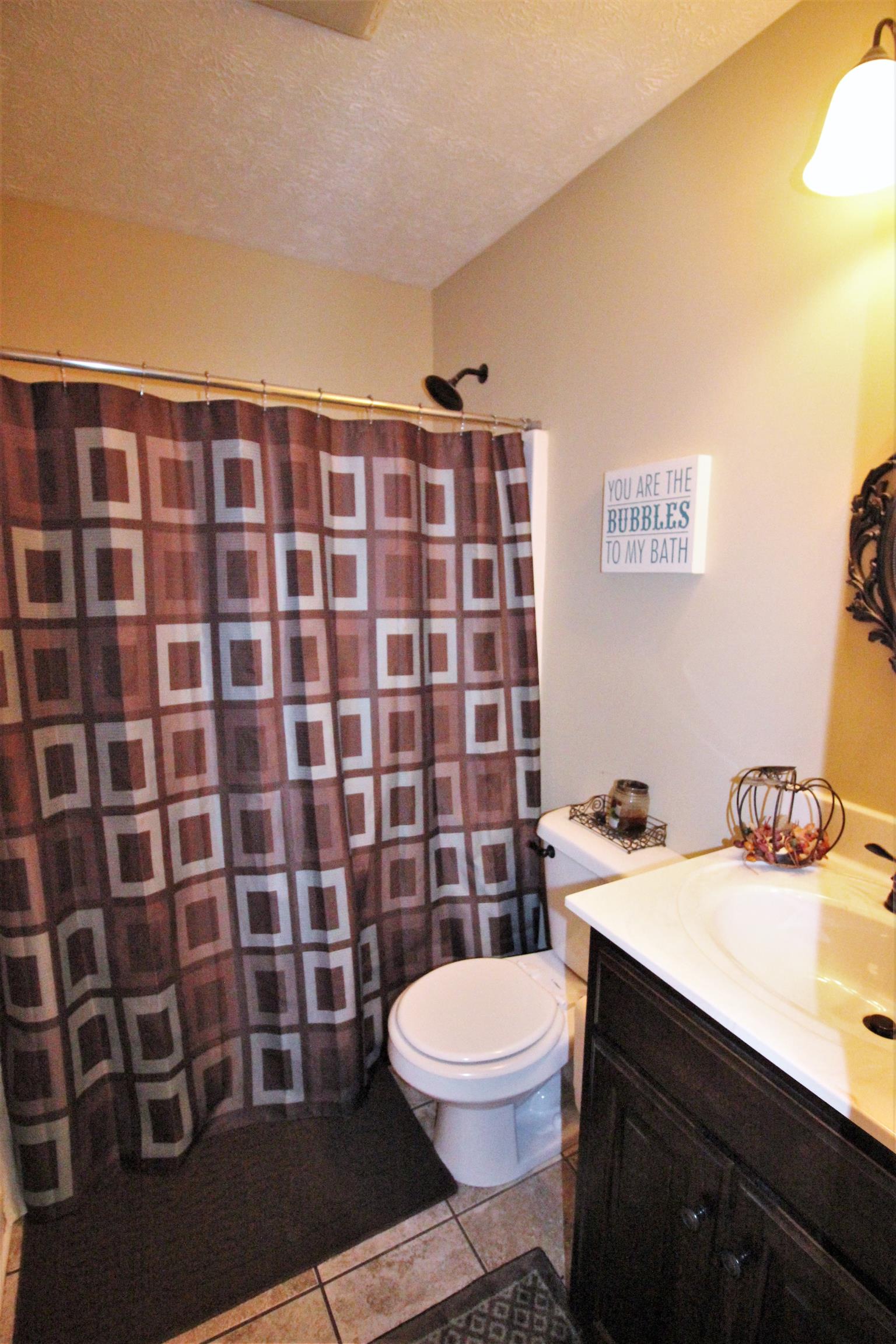 304 Williams Road Manchester, TN 37355 - Photo 14 of 20 a bathroom with a sink a toilet and shower
