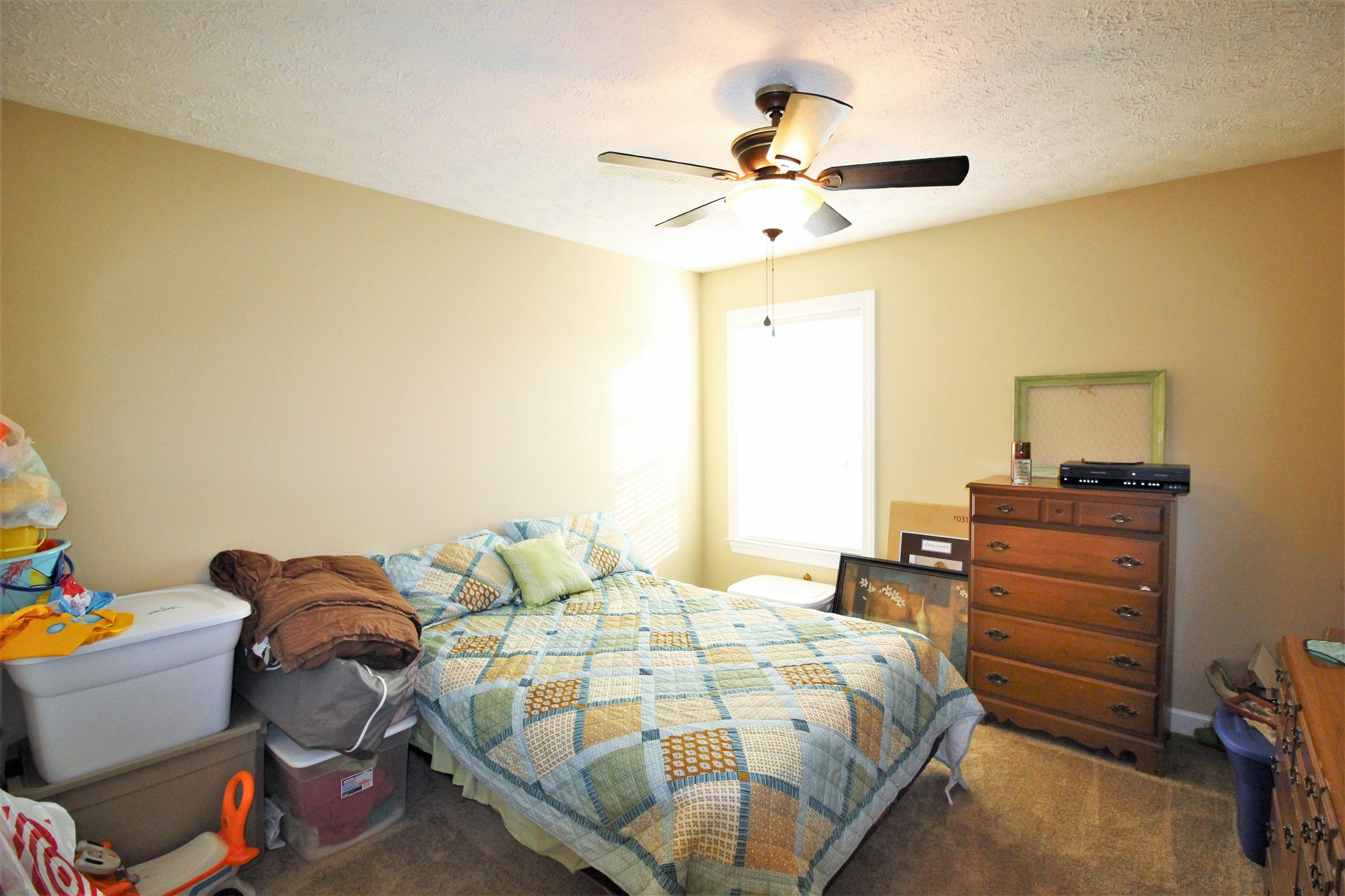 304 Williams Road Manchester, TN 37355 - Photo 15 of 20 a bedroom with a bed and a chandelier