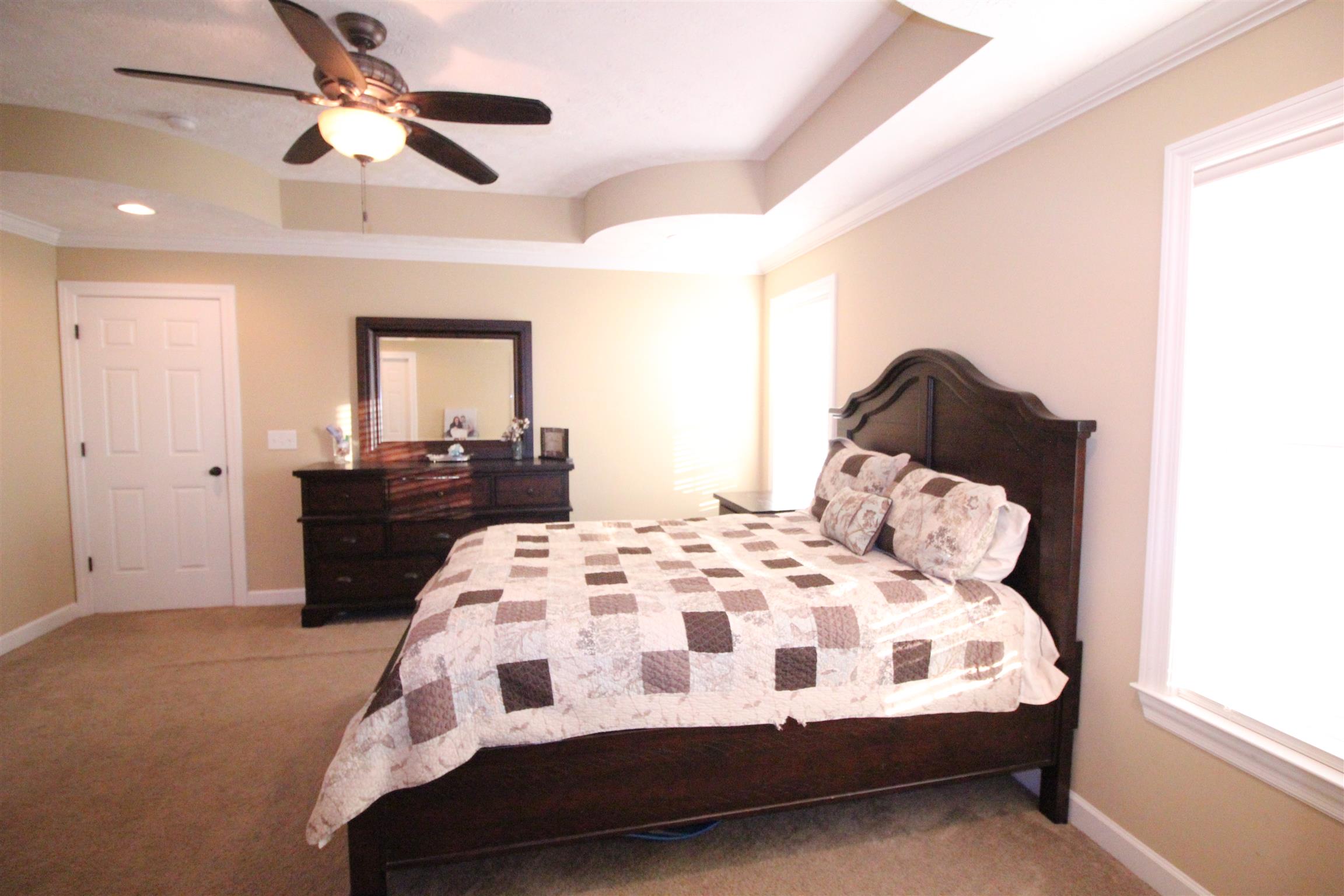 304 Williams Road Manchester, TN 37355 - Photo 10 of 20 a bedroom with a bed and a chandelier