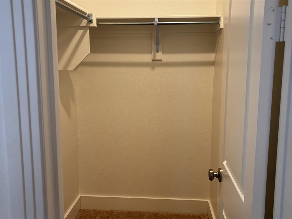 2828 Walden Road Celina, TX 75009 - Photo 7 of 30 Closet space with carpet flooring and built-in shelving and rod