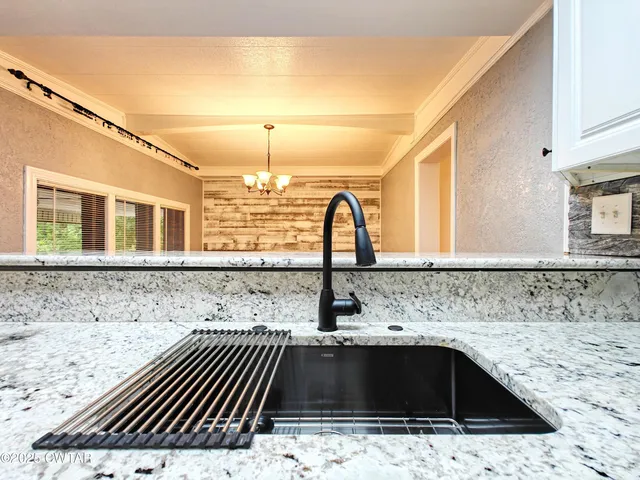 a kitchen with a sink and cabinets