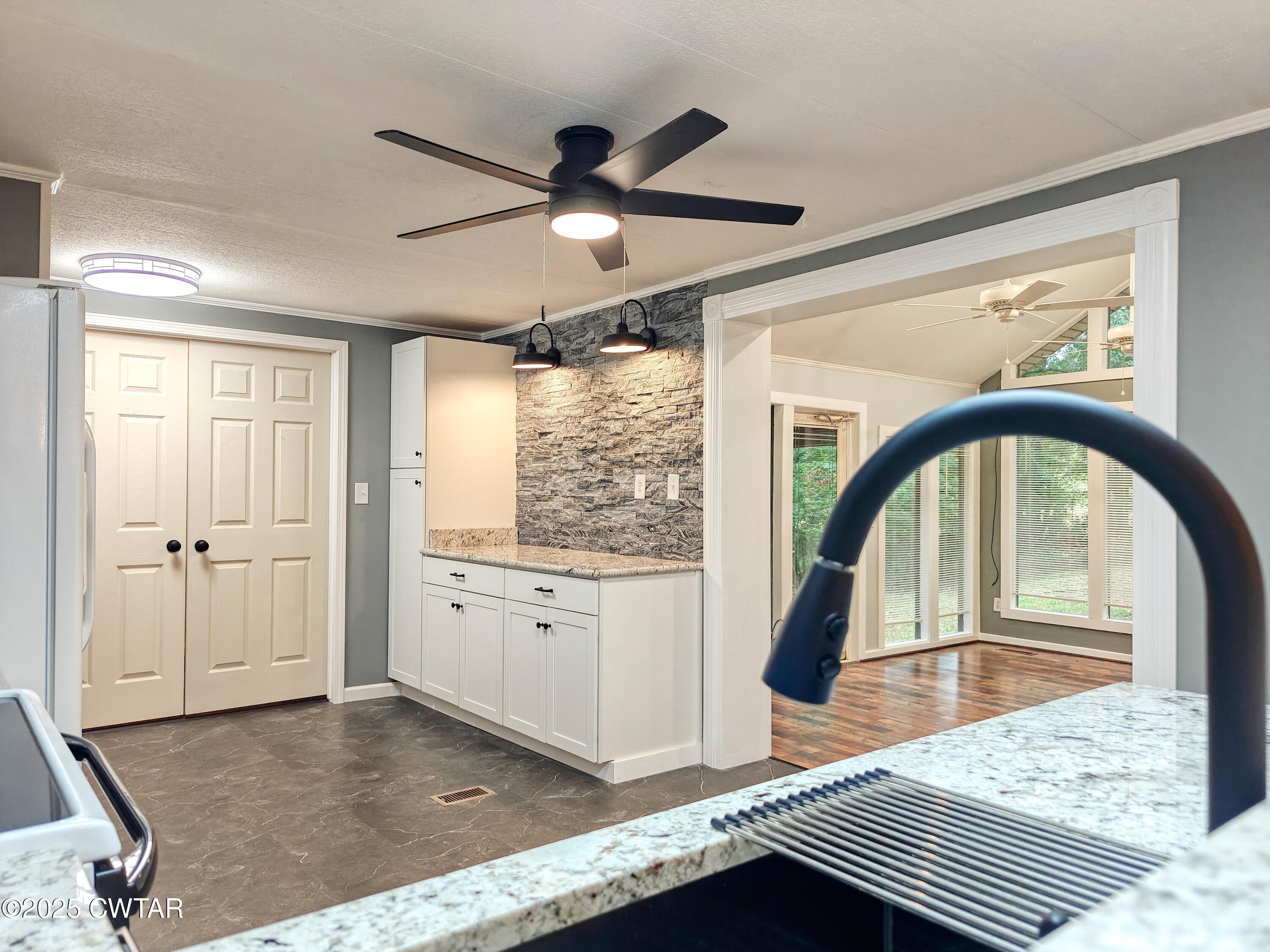 260 Cotham Drive Huntingdon, TN 38344 - Photo 15 of 29 a living room with granite countertop furniture and a wooden floor