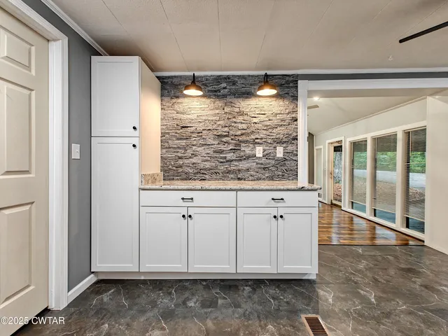 a view of kitchen with windows