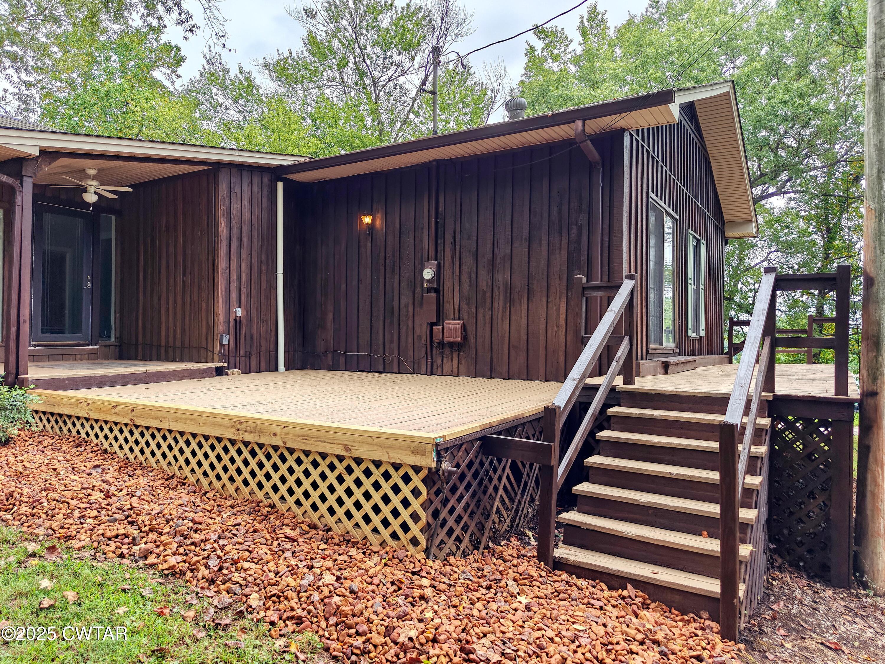 260 Cotham Drive Huntingdon, TN 38344 - Photo 6 of 29 a view of a house with a wooden fence