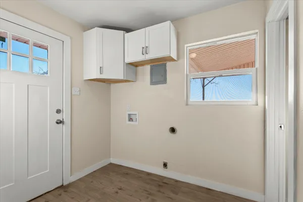 a view of kitchen with wooden floor