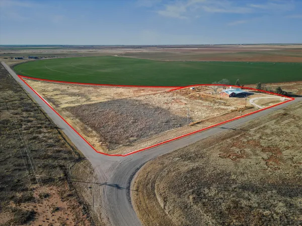 a view of a backyard of the house