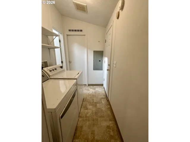 a view of walk in closet with rug