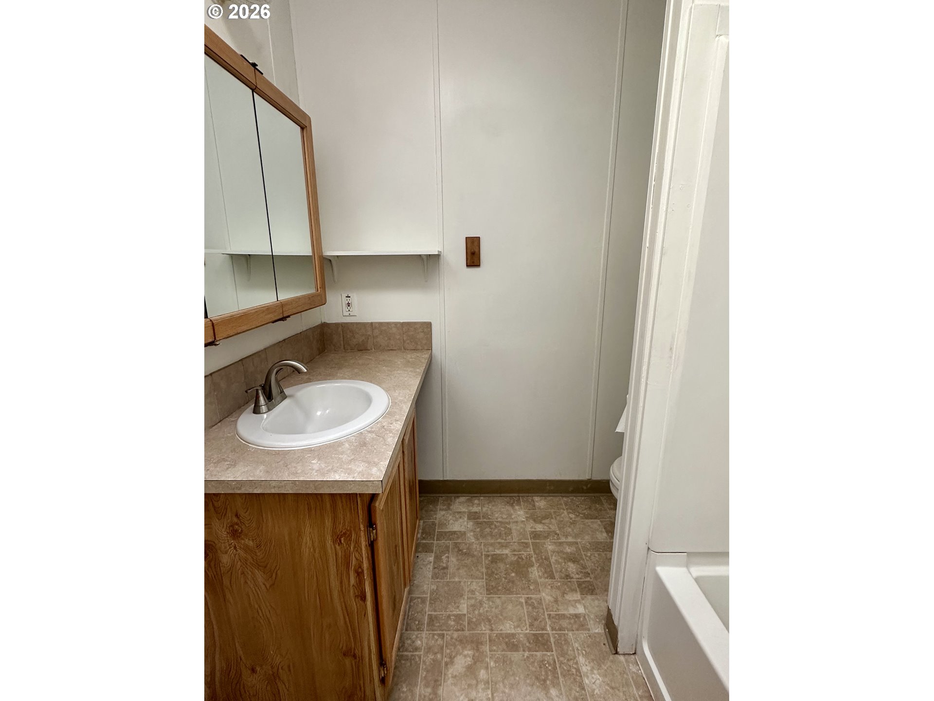 2009 Lewis River Road, Unit 17 Woodland, WA 98674 - Photo 23 of 32 a bathroom with a sink and a mirror