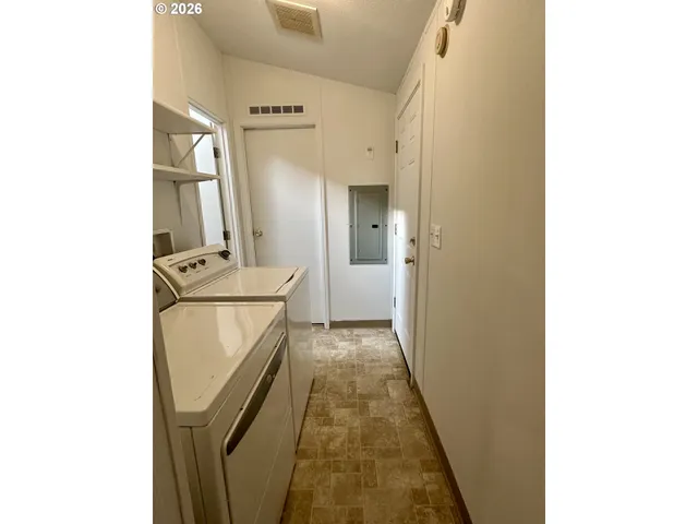 a view of hallway with washer and dryer