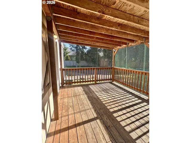 a view of balcony with wooden floor
