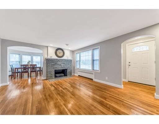644 Boston Road Springfield, MA 01119 - Photo 8 of 21 a view of an empty room with wooden floor fireplace and a window