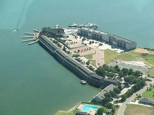 a kitchen with a sink a stove and a window