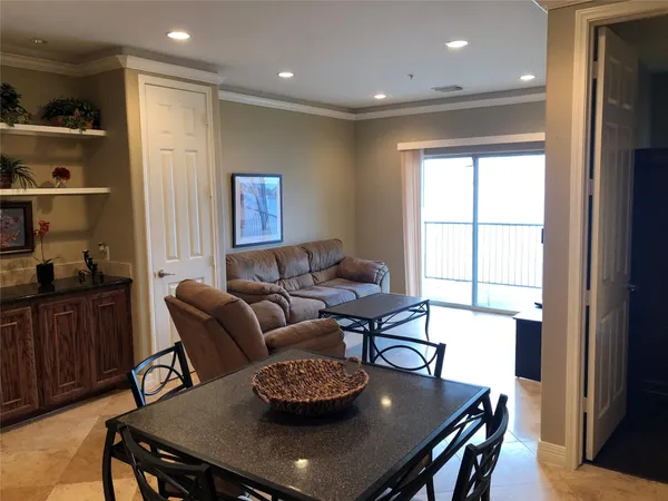 a kitchen with a table and chairs in it