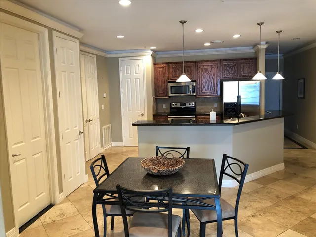 a bedroom with a large bed and a large window