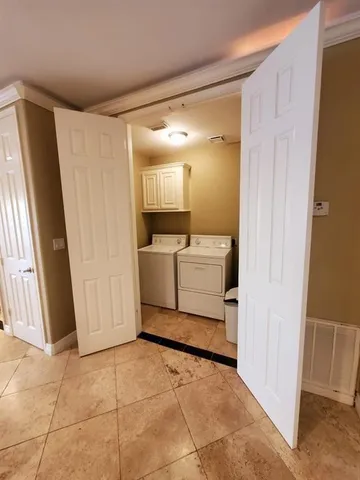 a bathroom with a granite countertop toilet and a sink