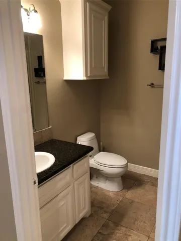 a view of a livingroom with furniture a ceiling fan and window