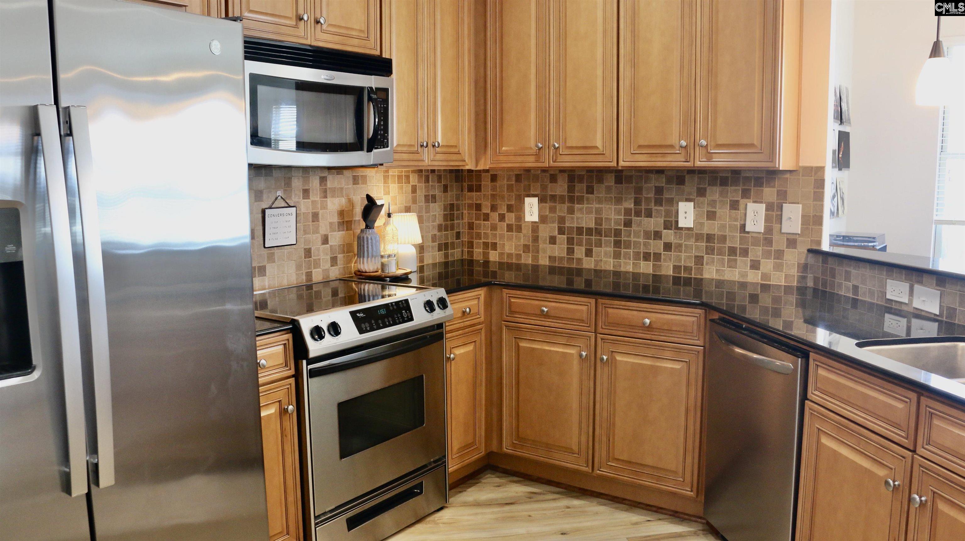 601 Main Street, Unit 323 Columbia, SC 29201 - Photo 12 of 68 a kitchen with a stove microwave and sink