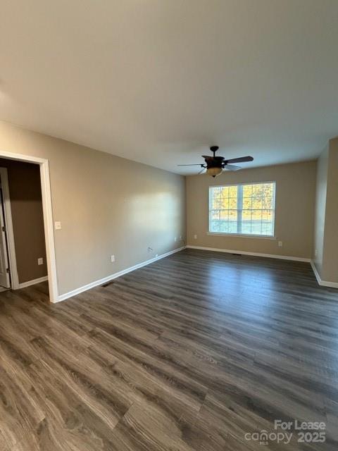 4715 Horseshoe Bend Road Hudson, NC 28638 - Photo 11 of 18 an empty room with wooden floor and windows