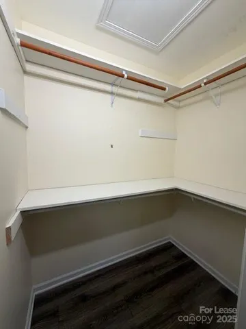 a view of an empty walk in closet