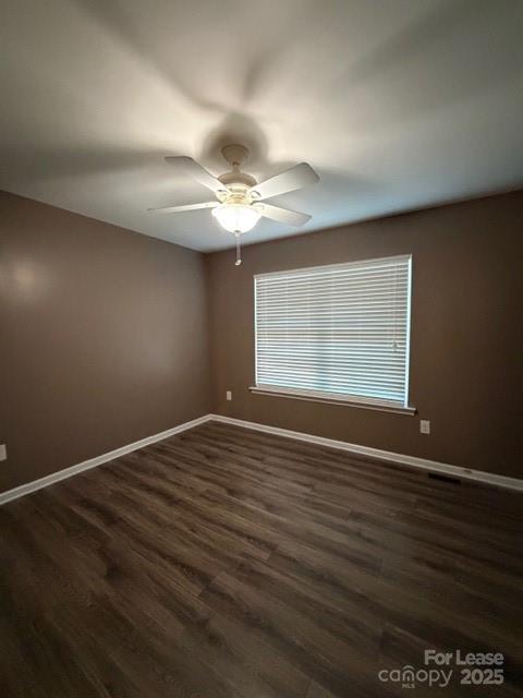 4715 Horseshoe Bend Road Hudson, NC 28638 - Photo 4 of 18 a view of an empty room with wooden floor and a window