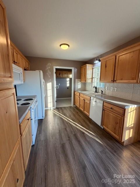 4715 Horseshoe Bend Road Hudson, NC 28638 - Photo 9 of 18 a kitchen with granite countertop a refrigerator a sink dishwasher a stove and white countertops with wooden floor