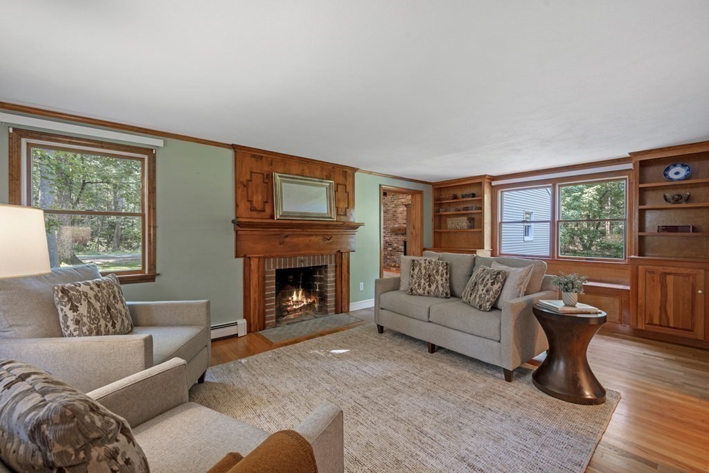 118 Herrick Road Boxford, MA 01921 - Photo 14 of 42 a living room with furniture and a fireplace