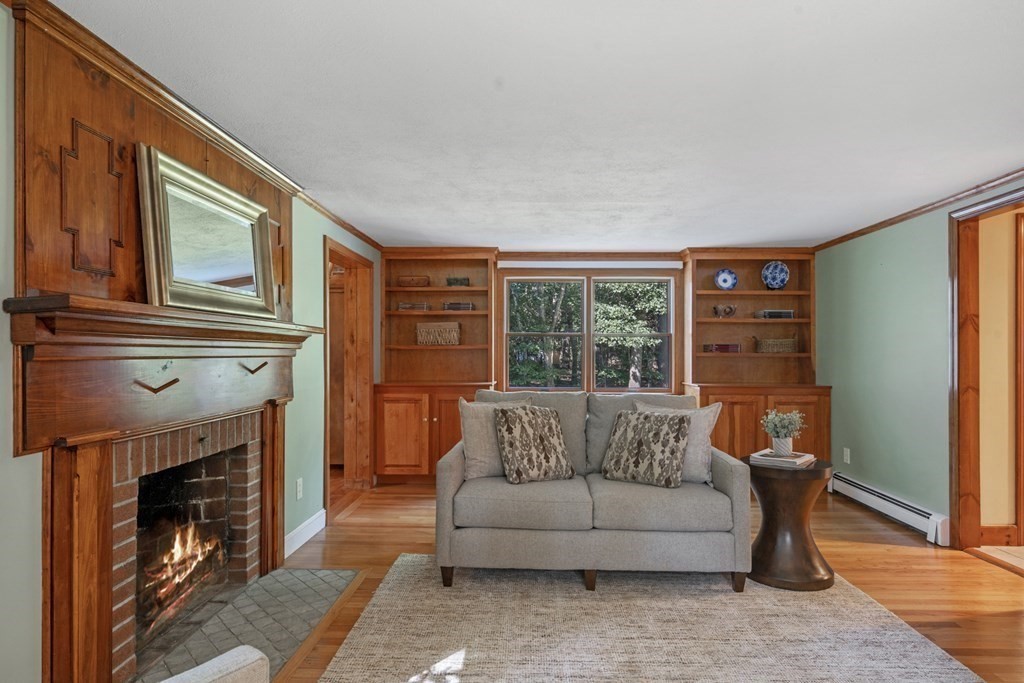 118 Herrick Road Boxford, MA 01921 - Photo 15 of 42 a living room with furniture a window and a fireplace