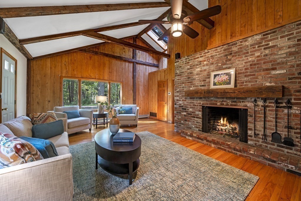118 Herrick Road Boxford, MA 01921 - Photo 18 of 42 a living room with furniture and a fireplace