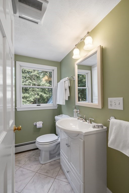 118 Herrick Road Boxford, MA 01921 - Photo 29 of 42 a bathroom with a sink toilet and mirror