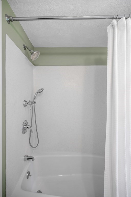 118 Herrick Road Boxford, MA 01921 - Photo 30 of 42 a bathroom with a bath tub with a shower