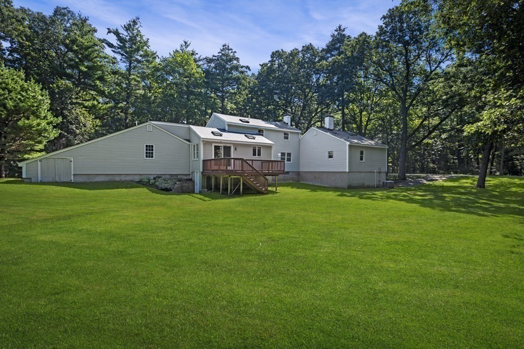 118 Herrick Road Boxford, MA 01921 - Photo 39 of 42 a aerial view of a house with a big yard and large trees