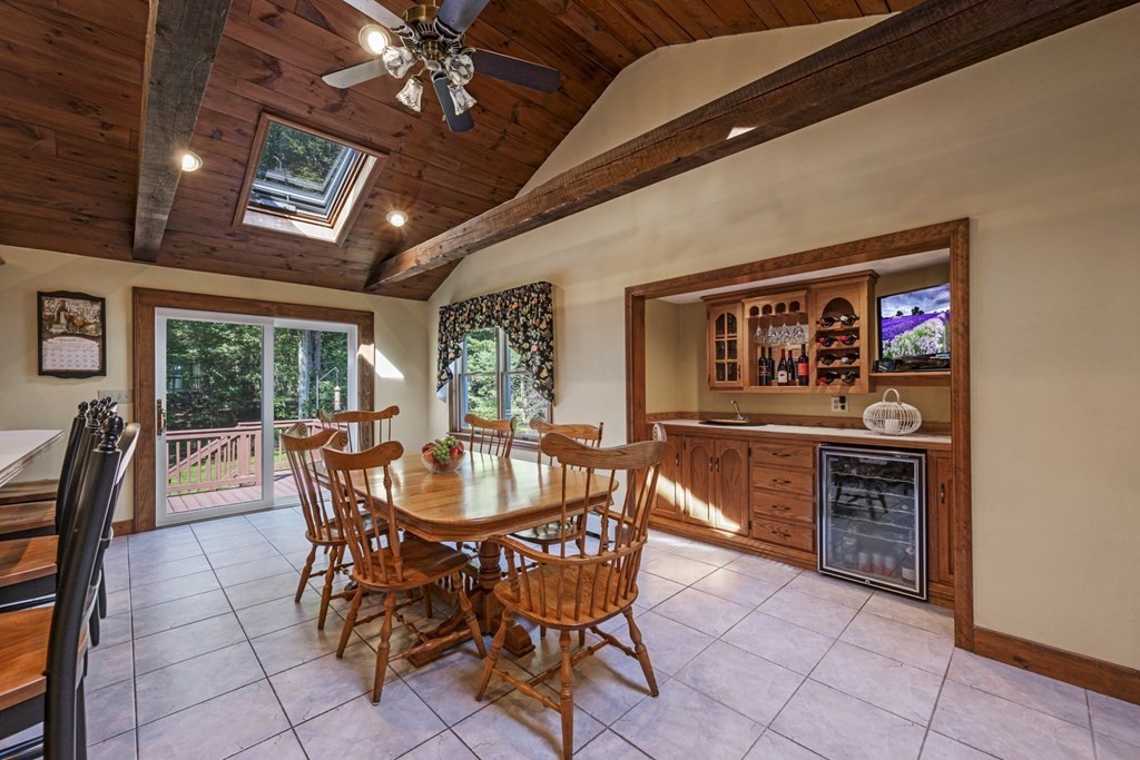 118 Herrick Road Boxford, MA 01921 - Photo 4 of 42 a dining room with furniture a floor to ceiling window and furniture