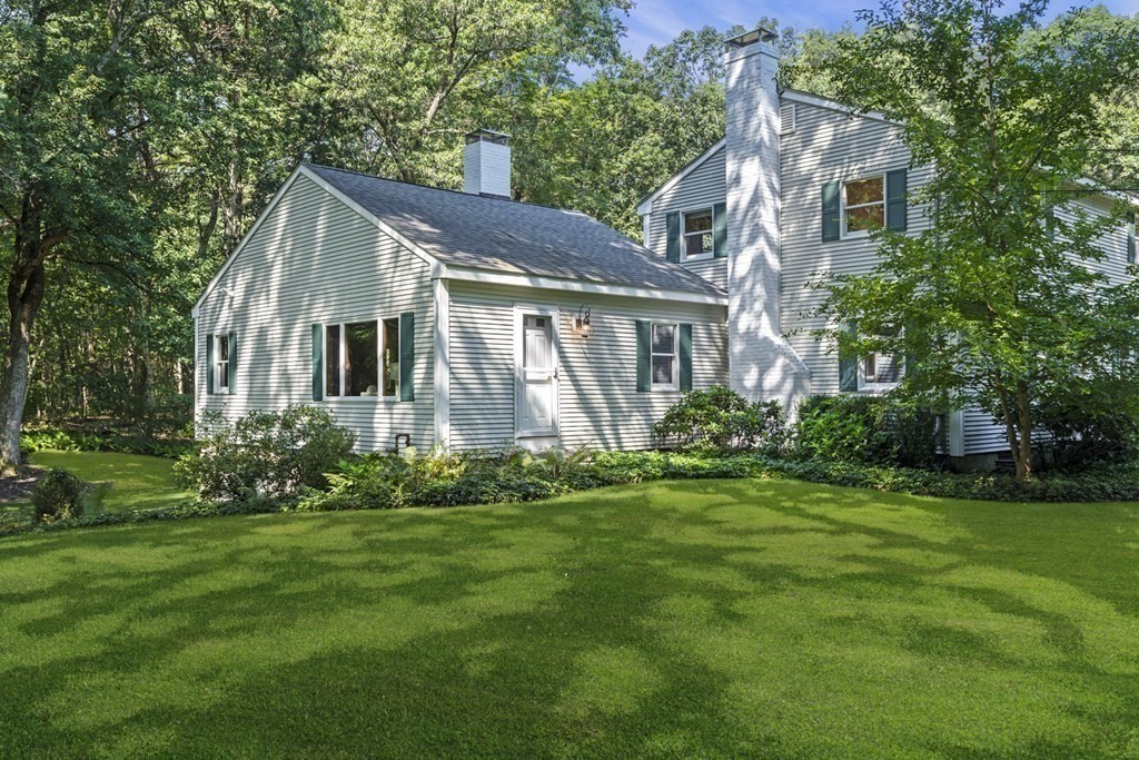 118 Herrick Road Boxford, MA 01921 - Photo 42 of 42 a front view of a house with a garden