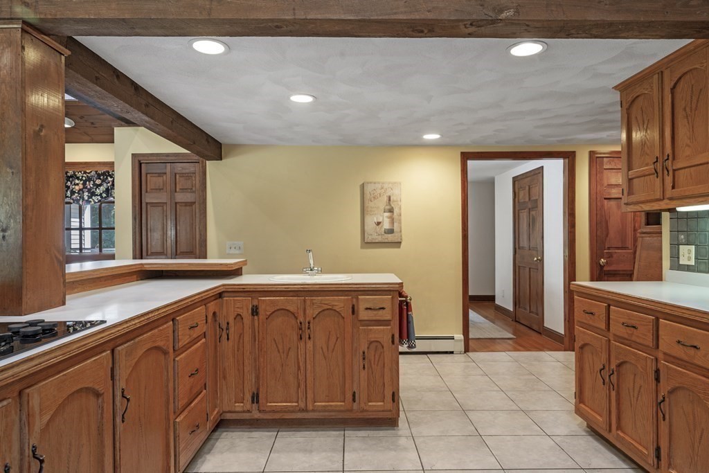 118 Herrick Road Boxford, MA 01921 - Photo 9 of 42 a large kitchen with a sink and cabinets