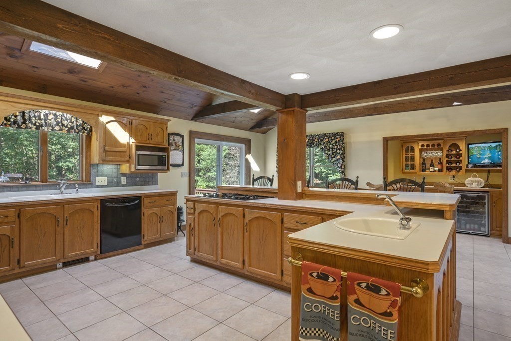 118 Herrick Road Boxford, MA 01921 - Photo 10 of 42 a kitchen with stainless steel appliances granite countertop a sink and cabinets