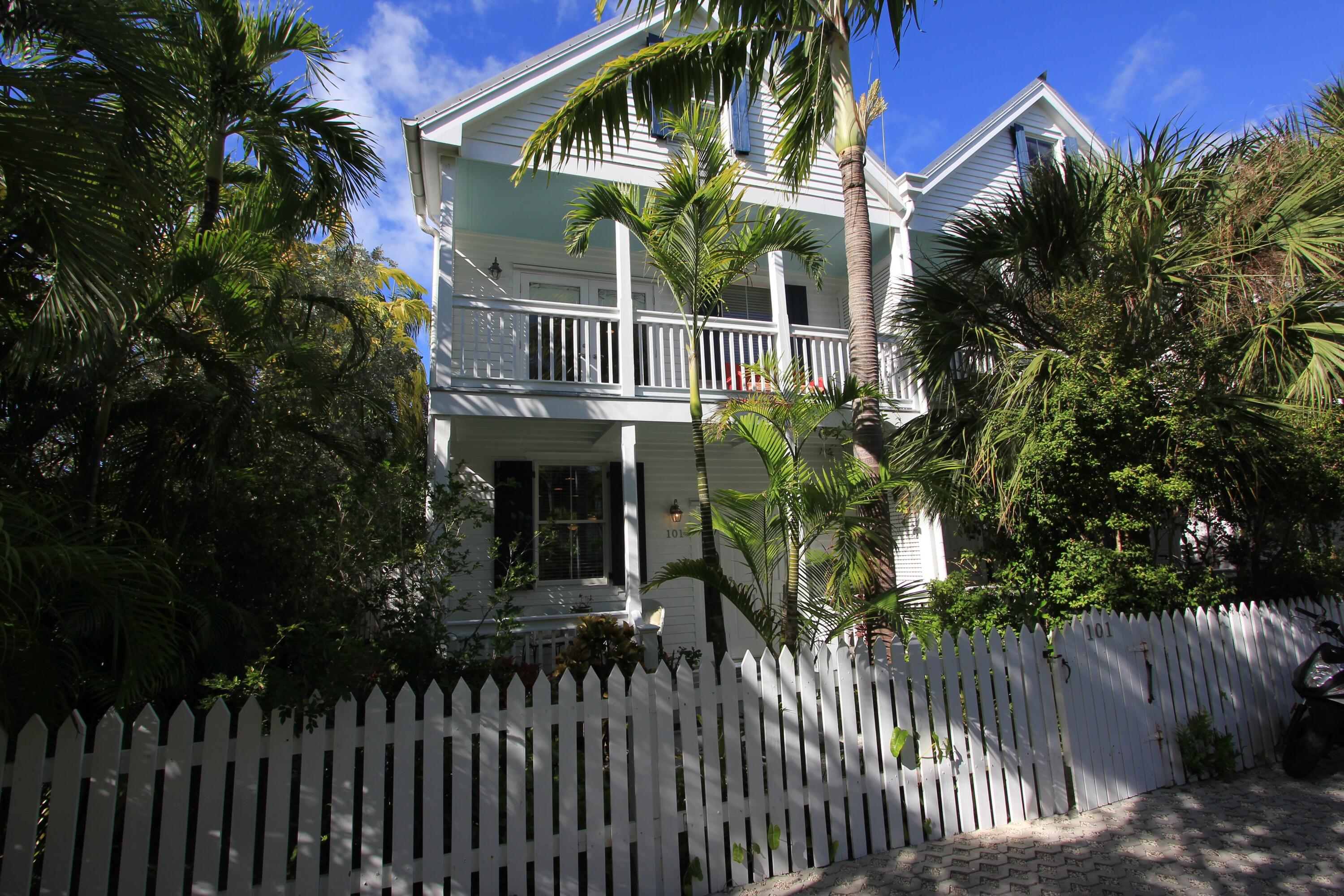 a front view of house and yard with green space