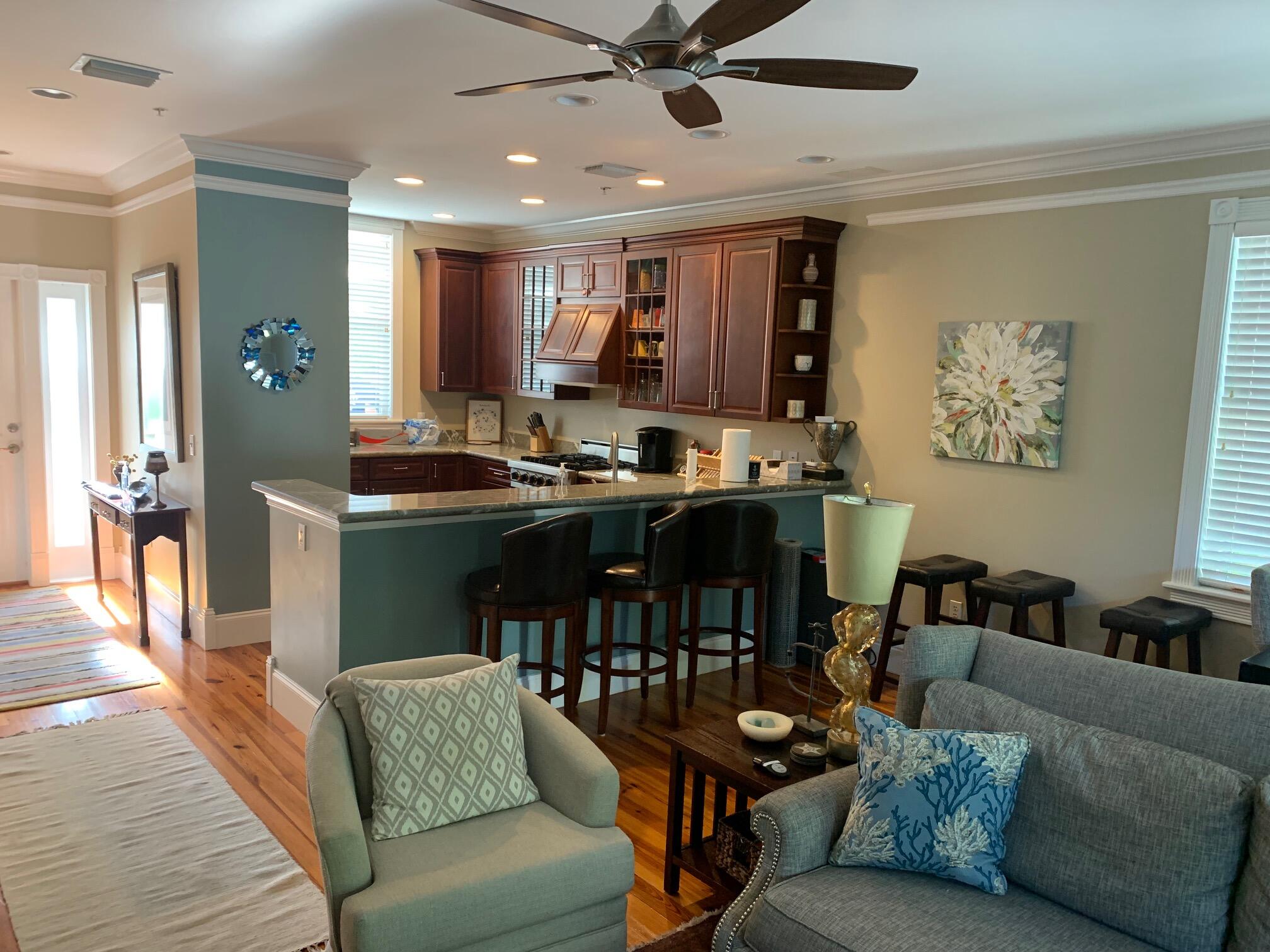807 Washington Street, Unit 101 Key West, FL 33040 - Photo 12 of 29 a living room with furniture kitchen view and a window