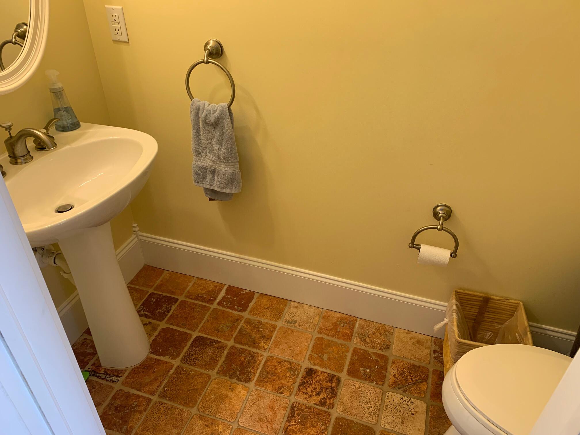 807 Washington Street, Unit 101 Key West, FL 33040 - Photo 13 of 29 a bathroom with a sink and mirror