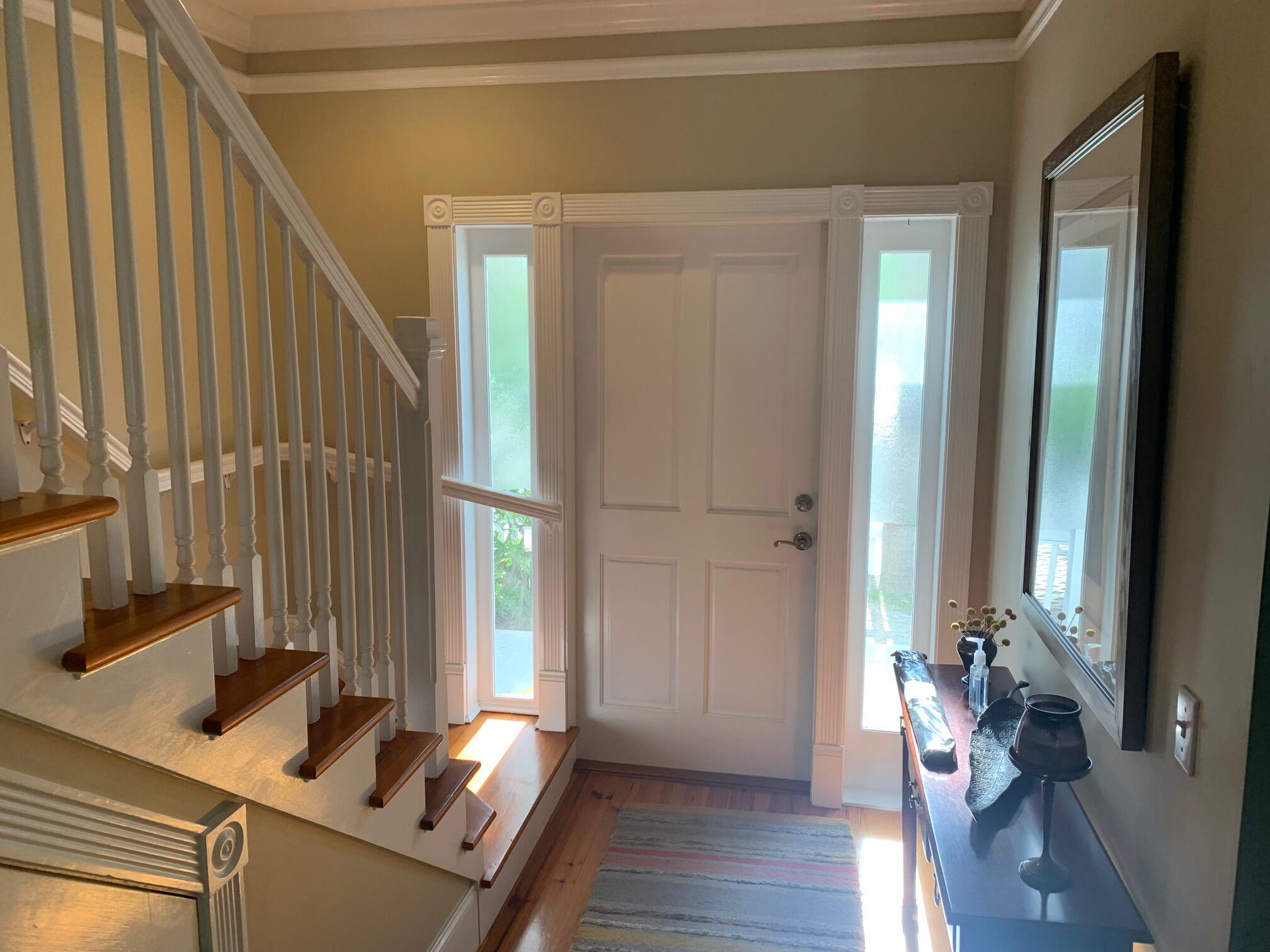 807 Washington Street, Unit 101 Key West, FL 33040 - Photo 14 of 29 a view of a room with wooden floor and windows