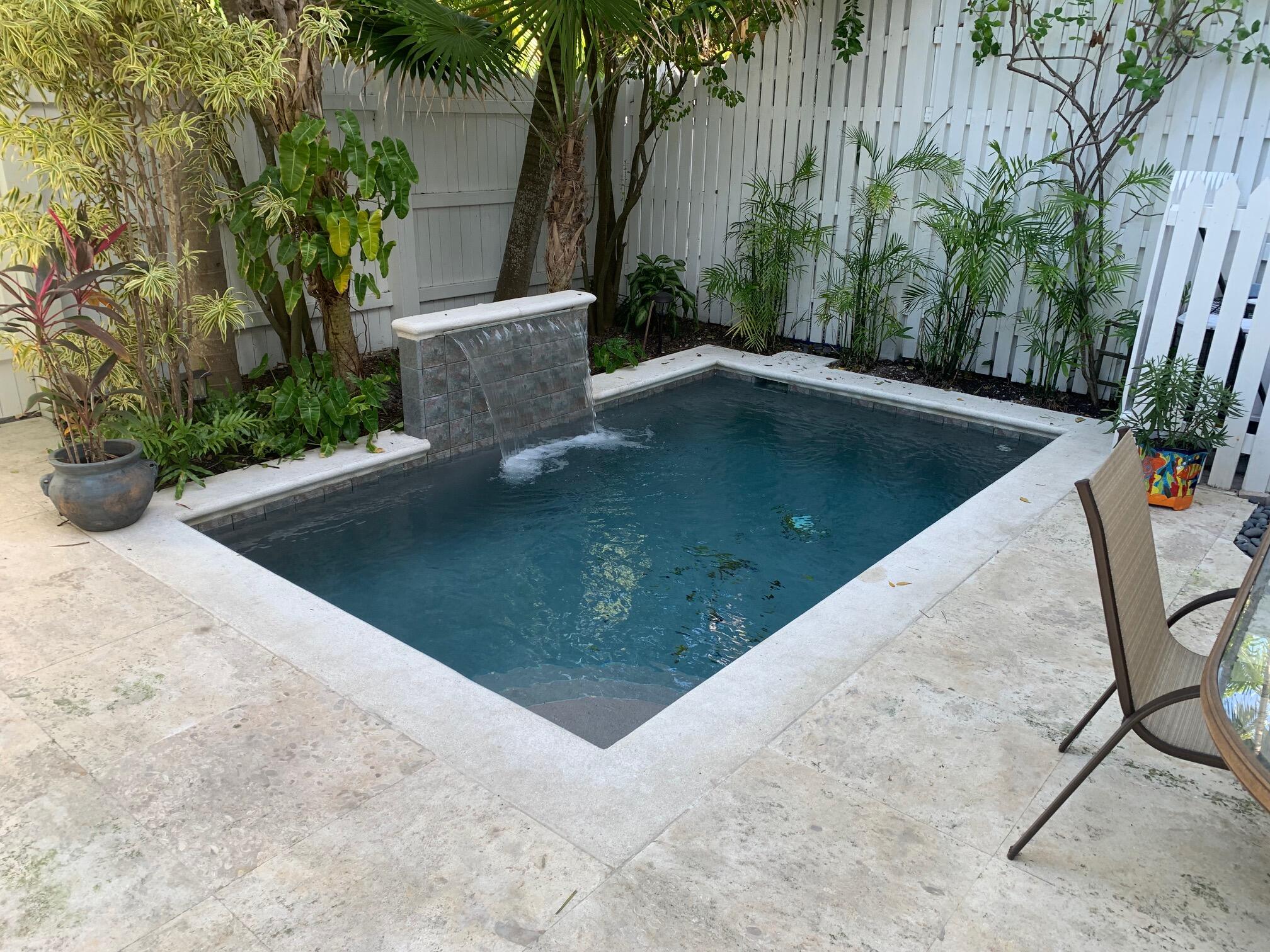 807 Washington Street, Unit 101 Key West, FL 33040 - Photo 15 of 29 a view of a swimming pool with an outdoor space