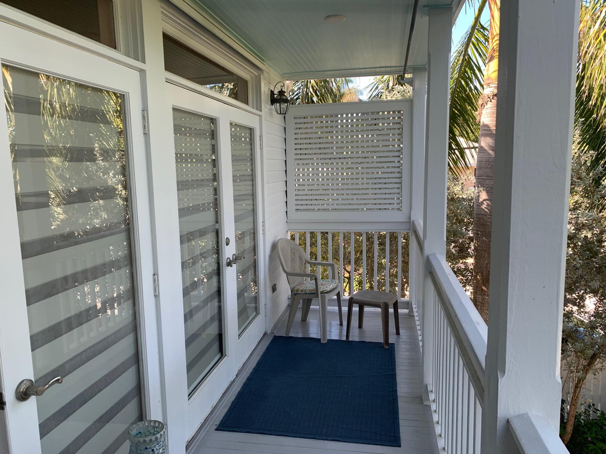 807 Washington Street, Unit 101 Key West, FL 33040 - Photo 20 of 29 a view of a balcony with chairs