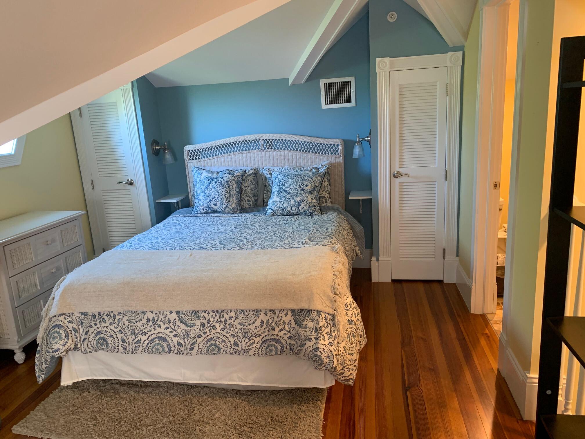 807 Washington Street, Unit 101 Key West, FL 33040 - Photo 24 of 29 a large bed sitting in a bedroom next to a window