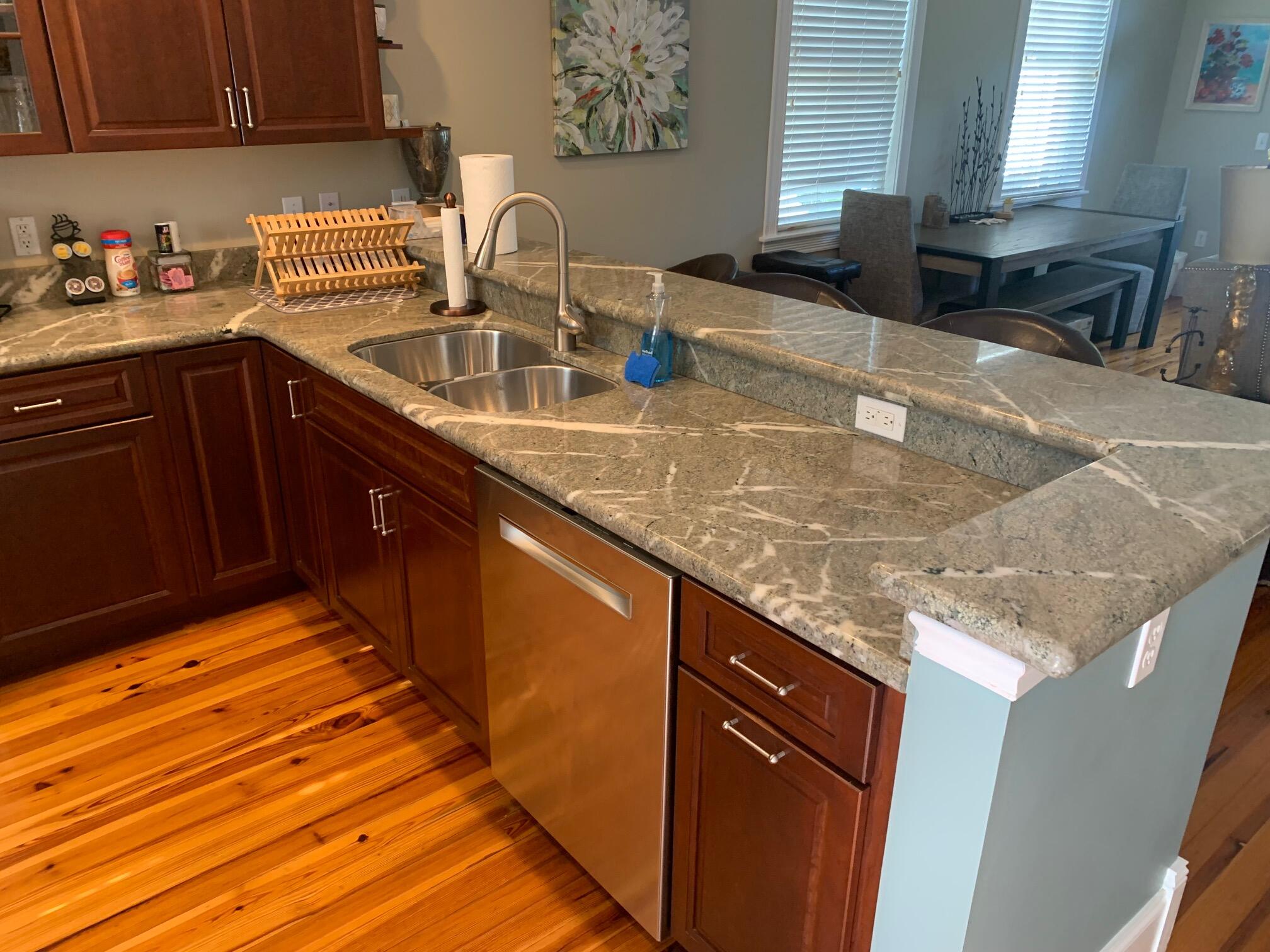 807 Washington Street, Unit 101 Key West, FL 33040 - Photo 6 of 29 a kitchen with granite countertop a sink and a stove