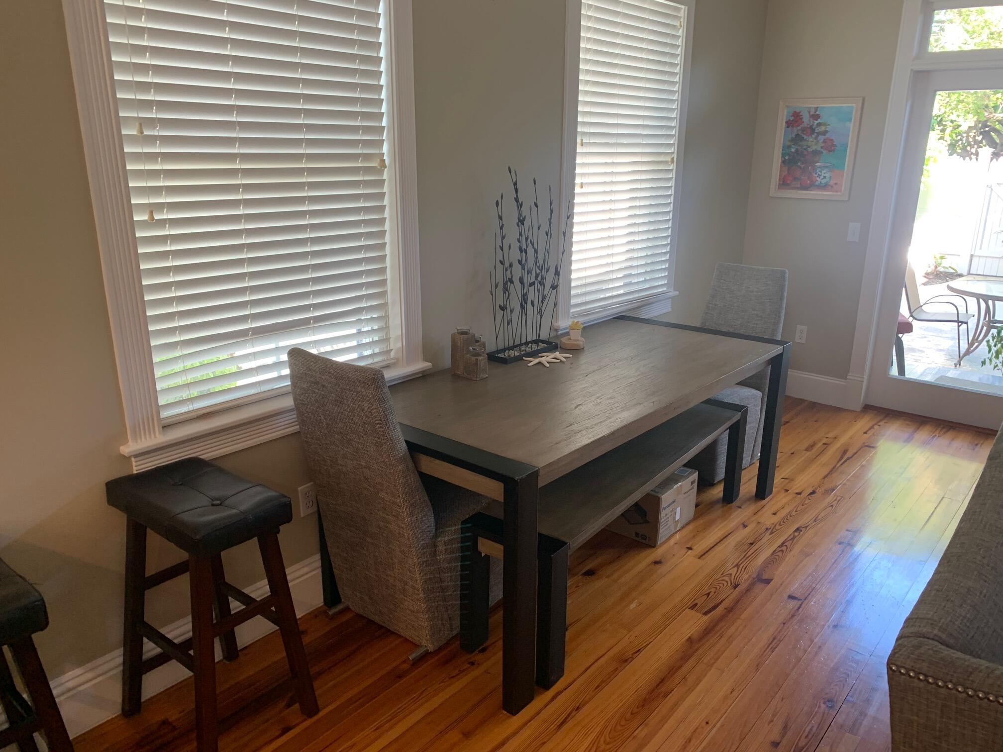 807 Washington Street, Unit 101 Key West, FL 33040 - Photo 7 of 29 a view of a dining room with furniture and wooden floor